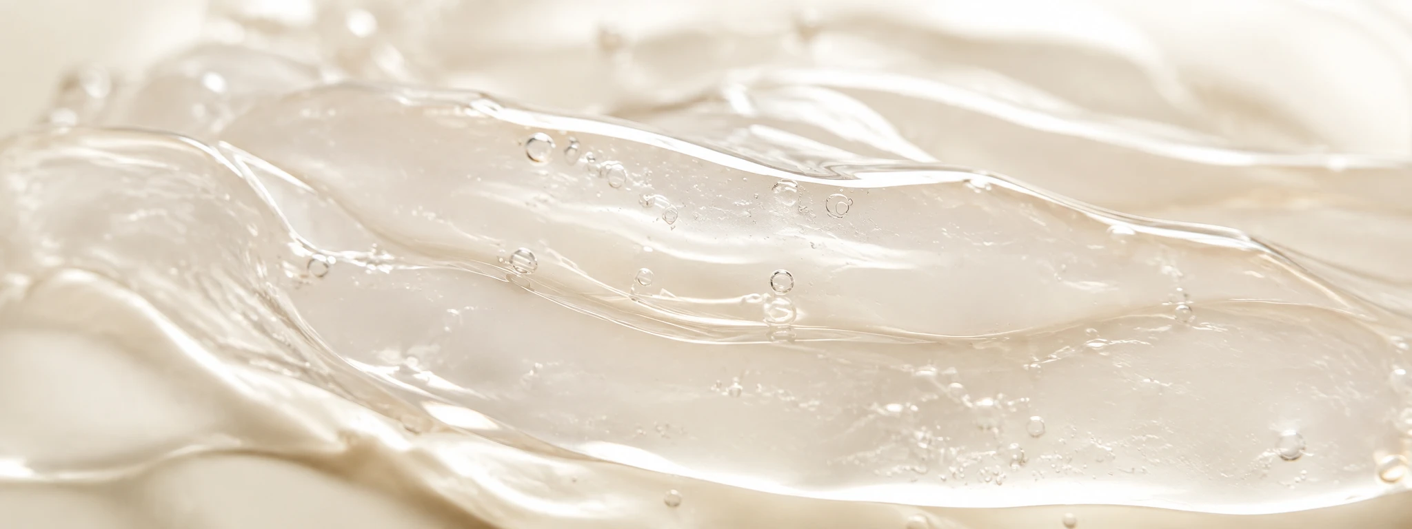 Translucent ivory hydrogel material with soft layered folds and a wet sheen.